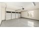 Clean two-car garage with epoxy flooring and an automatic door at 23063 W Loma Linda Blvd, Buckeye, AZ 85326