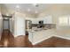Well-lit kitchen with white cabinets, stainless steel appliances, and a convenient breakfast bar at 23063 W Loma Linda Blvd, Buckeye, AZ 85326