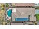 Aerial view of single-Gathering home with swimming pool, desert landscaping and solar panels on the roof at 2452 W Muirfield Dr, Anthem, AZ 85086