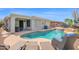 Luxurious backyard pool and patio area, ideal for outdoor living and entertaining in the desert landscape at 2452 W Muirfield Dr, Anthem, AZ 85086