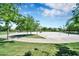 The community park features a full basketball court surrounded by lush greenery at 2452 W Muirfield Dr, Anthem, AZ 85086