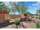 A welcoming Anthem Golf & Country Club entrance with stone signage and beautiful landscaping at 2452 W Muirfield Dr, Anthem, AZ 85086