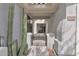 Charming gated entrance with desert landscaping and visible house number at 2452 W Muirfield Dr, Anthem, AZ 85086