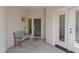 Welcoming entrance area with a bench and decorative front door at 2452 W Muirfield Dr, Anthem, AZ 85086