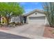 Beautiful single-story home with well-manicured landscaping and a two-car garage at 2452 W Muirfield Dr, Anthem, AZ 85086