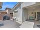 Cozy outdoor patio with grill, seating, and well-maintained concrete at 2452 W Muirfield Dr, Anthem, AZ 85086