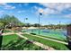 Outdoor pickleball courts surrounded by lush greenery and shaded benches in Anthem at 2452 W Muirfield Dr, Anthem, AZ 85086