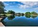 A serene community pond is surrounded by picnic areas and walking trails, a perfect outdoor oasis at 2452 W Muirfield Dr, Anthem, AZ 85086