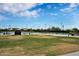 Several shaded tennis courts and lush green scenery make for a great tennis park at 2452 W Muirfield Dr, Anthem, AZ 85086