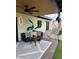 Relaxing outdoor patio featuring stylish seating, a ceiling fan and lush decor at 2517 E Sahuaro Dr, Phoenix, AZ 85028