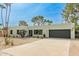 Contemporary home featuring desert landscaping, modern architecture, and a spacious driveway at 2517 E Sahuaro Dr, Phoenix, AZ 85028