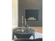 Close-up of a modern black fireplace with stylish decor and a cozy ambiance at 2517 E Sahuaro Dr, Phoenix, AZ 85028