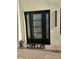 Chic front door with sidelights, features a welcome mat and stylish exterior lighting at 2517 E Sahuaro Dr, Phoenix, AZ 85028