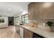 Bright kitchen features granite countertops, stainless appliances, and seamless transition to a spacious living room at 2517 E Sahuaro Dr, Phoenix, AZ 85028