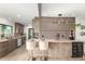Bright and modern kitchen with stainless steel appliances, wine fridge and granite countertops with room for two at 2517 E Sahuaro Dr, Phoenix, AZ 85028