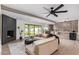 Open-concept living room boasts hardwood floors, fireplace, and seamless indoor-outdoor living at 2517 E Sahuaro Dr, Phoenix, AZ 85028