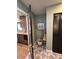 Cozy mudroom features patterned tile floors, accent green wall, and built-in storage at 2517 E Sahuaro Dr, Phoenix, AZ 85028