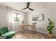Bright home office featuring a modern desk, comfortable chair, and large window at 2517 E Sahuaro Dr, Phoenix, AZ 85028