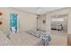 Bright bedroom with a full sized bed, mirrored closet, and access to the bathroom at 252 E Orange Dr, Phoenix, AZ 85012