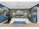 Modern bedroom featuring an exercise bike, patterned wallpaper, and white metal bedframe at 252 E Orange Dr, Phoenix, AZ 85012