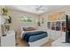Well lit bedroom with bed, cube shelves, large windows and desk space at 252 E Orange Dr, Phoenix, AZ 85012