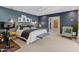 Bedroom featuring patterned wallpaper, exercise equipment, and ample natural light at 252 E Orange Dr, Phoenix, AZ 85012