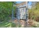 Backyard activity area with a custom climbing wall and adjacent soccer net, perfect for active play at 252 E Orange Dr, Phoenix, AZ 85012