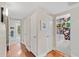 Hallway with hardwood floors and doorways leading to the bathroom and bedrooms at 252 E Orange Dr, Phoenix, AZ 85012
