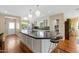 Spacious kitchen featuring a large island, modern appliances, and plenty of natural light at 252 E Orange Dr, Phoenix, AZ 85012
