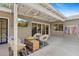 Covered patio with comfortable seating, a TV, and views of the backyard at 252 E Orange Dr, Phoenix, AZ 85012