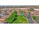 Overhead neighborhood view of a well-manicured green space and community pool at 2534 N 73Rd Dr, Phoenix, AZ 85035