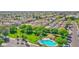 Community aerial view featuring a pool, park, green spaces, and well-maintained landscaping at 2534 N 73Rd Dr, Phoenix, AZ 85035
