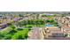 Aerial view of the neighborhood highlighting lush green spaces, mature trees and a community pool at 2534 N 73Rd Dr, Phoenix, AZ 85035
