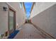 Backyard featuring a wooden patio and a gate at the end of the yard at 2534 N 73Rd Dr, Phoenix, AZ 85035