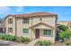 Two-story home with a terracotta-tiled roof, a front porch, and desert landscaping in front at 2534 N 73Rd Dr, Phoenix, AZ 85035