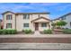 Charming two-story townhome featuring a covered porch and well-maintained landscaping at 2534 N 73Rd Dr, Phoenix, AZ 85035