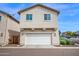 Exterior view of a two-car garage and front of home at 2534 N 73Rd Dr, Phoenix, AZ 85035
