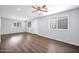 Bright living room featuring hardwood floors, neutral paint, and multiple windows for natural light at 2534 N 73Rd Dr, Phoenix, AZ 85035