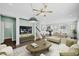Bright living room with modern furnishings, including a sofa, ottoman, and decorative coffee table at 2534 N 73Rd Dr, Phoenix, AZ 85035