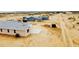 Spacious single-story home features a light gray roof and desert landscaping at 25745 W Peak View Rd, Wittmann, AZ 85361