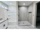 Well-lit bathroom featuring a tiled shower, separate bathtub, and modern fixtures at 25745 W Peak View Rd, Wittmann, AZ 85361