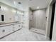 Spacious bathroom features modern vanity, tiled shower, and separate soaking tub at 25745 W Peak View Rd, Wittmann, AZ 85361