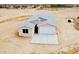 New home with a modern design, neutral colors, a two-car garage, and a concrete driveway at 25745 W Peak View Rd, Wittmann, AZ 85361