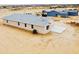 New home with a modern design, neutral colors, a two-car garage, and an air conditioning unit at 25745 W Peak View Rd, Wittmann, AZ 85361