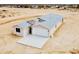 New home with a modern design, neutral colors, a two-car garage, and a concrete driveway at 25745 W Peak View Rd, Wittmann, AZ 85361