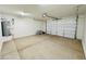 Spacious garage with overhead door, water heater, and ample storage or parking at 25745 W Peak View Rd, Wittmann, AZ 85361