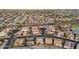 Large-scale aerial view showcasing residential areas interspersed with roadways and green spaces at 2722 N 155Th Dr, Goodyear, AZ 85395