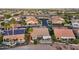 Aerial view of a neighborhood with well-maintained homes, solar panels and inviting outdoor spaces at 2722 N 155Th Dr, Goodyear, AZ 85395