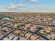 Wide aerial shot showcasing a vast residential area with a mix of homes and community amenities at 2722 N 155Th Dr, Goodyear, AZ 85395