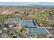 Stunning aerial view of pickleball and tennis courts in a well-maintained community with mountain views in the distance at 2722 N 155Th Dr, Goodyear, AZ 85395